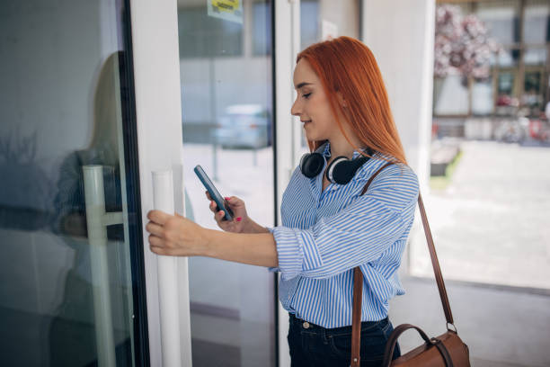 istock Woman entering office building 1713786323