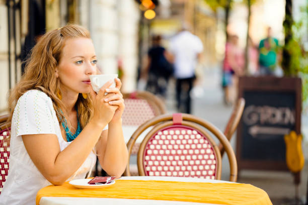 istock Young woman drinking a cappuccino 171378947