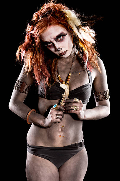 istock Front view of primative shamanic necromancer touching bone 171378975