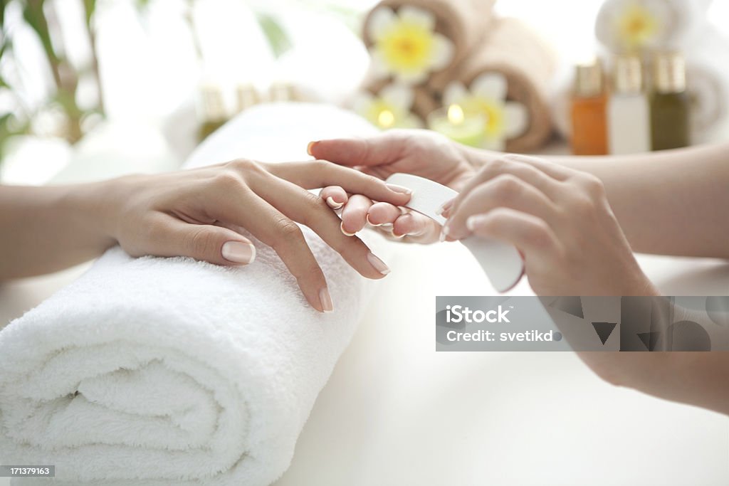 Manicure. Close up of beautiful female hands having manicure treatment.See more MANICURE and SPA images. Click on image below for lightbox. Manicure Stock Photo