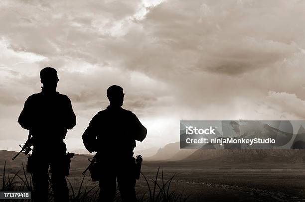 Army Soldiers In The Valley Of Death Stock Photo - Download Image Now - Armed Forces, In Silhouette, Courage