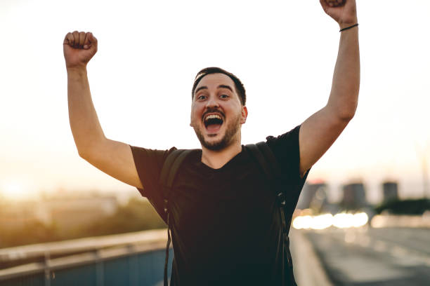 istock happy man walks across the bridge 1713796342