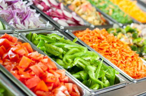 Selective-focus image of a fresh salad bar.