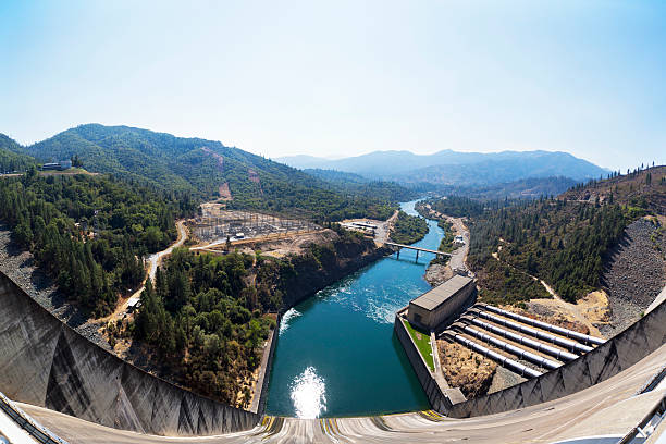 Hydro Power Plant Looking down at the spillway and hydro power plant from top of a Shasta Dam in California. mt shasta photos stock pictures, royalty-free photos & images