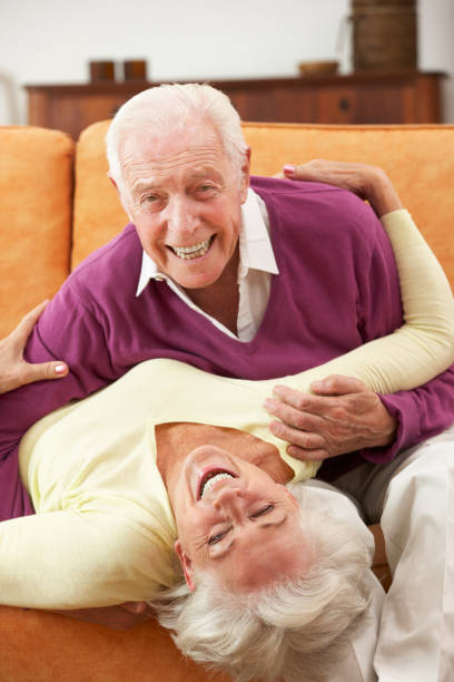 istock Romantic Senior Couple Lying On Sofa At Home 171379870