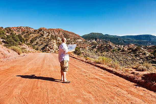 istock Man Lost in The Desert with Map 171381213