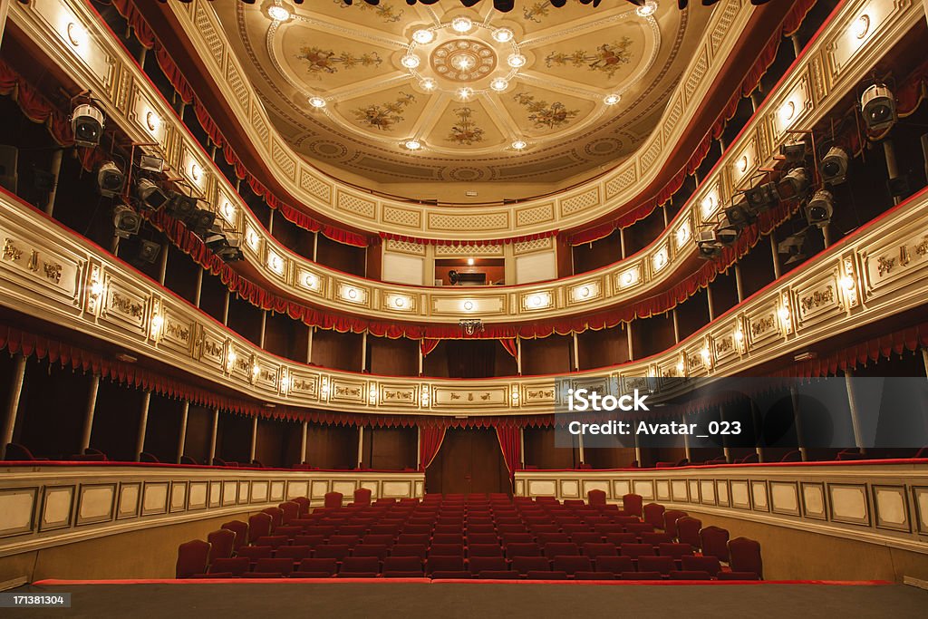 Classical Theater Classical Theater with Red stage curtain with arch lights and shadows.View from the stage Opera Stock Photo