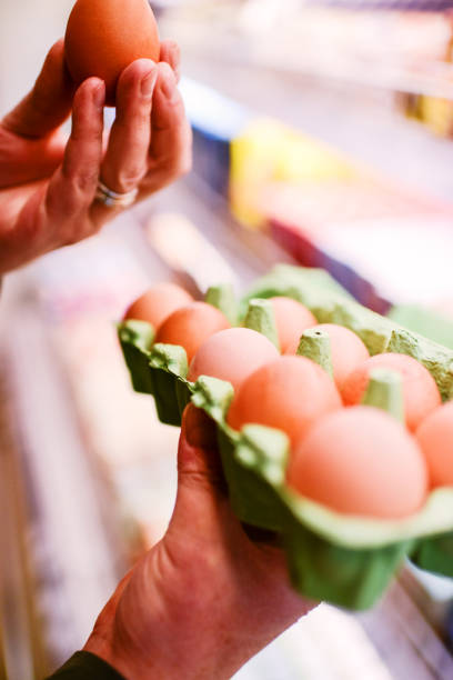istock Man choosing eggs  in grocery store 171381527