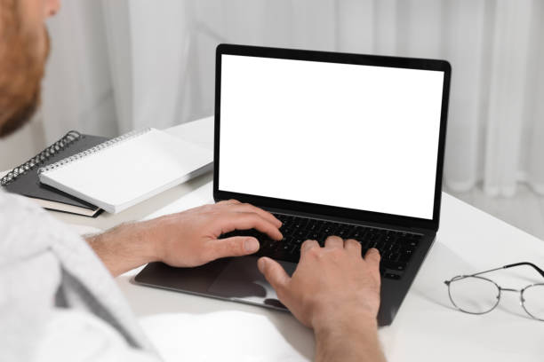 istock Man using laptop at white table indoors, closeup 1713817846