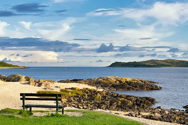 An empty summer seat in a position that looks out towards the Solway Firth in south west Scotland.