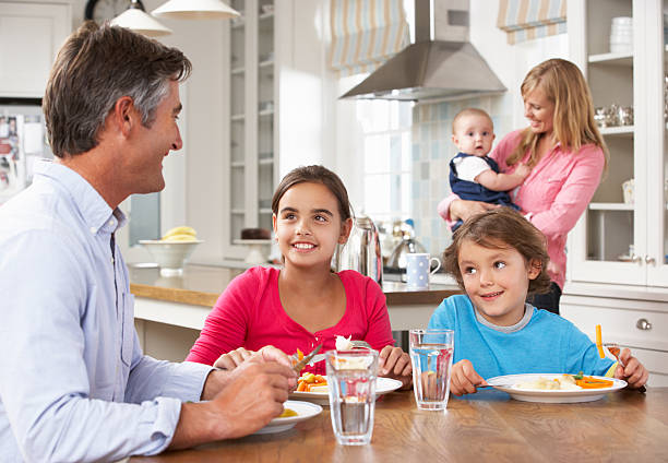 istock Family Having Meal In Kitchen Together 171381993