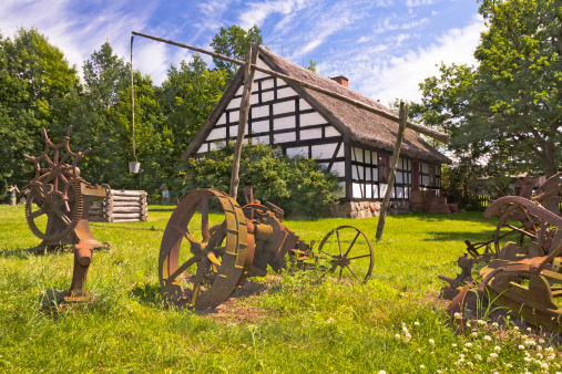 The old rusty machinery and agricultural implements on the farm, Wielkopolska, Poland