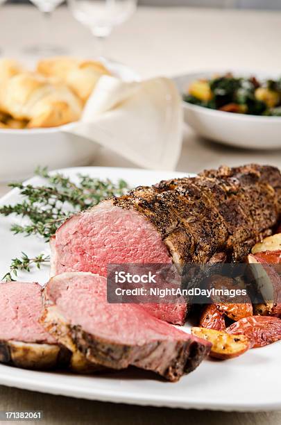 Roasted Tenderloin Served With Potatoes In White Plate Stock Photo - Download Image Now