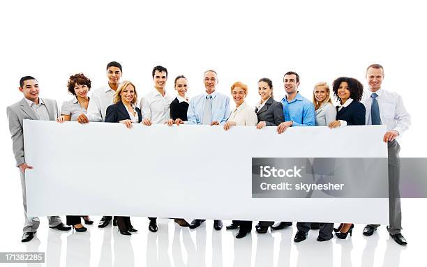 Business People Holding A Banner Stock Photo - Download Image Now - Holding, Human Resources, Banner - Sign