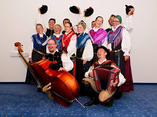 Traditional group "Group of Slovenian dancers and musicians in traditional Slovenian costumes expressing their joy, Bled, Slovenia." gorenjska stock pictures, royalty-free photos & images