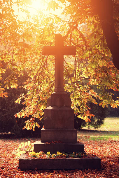 silhouette of the crosses of a catholic cemetery at sundown