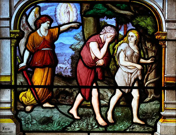 "Detail of a stained glass window form 1887 of the church Siant Aignan, Chartres. The window is made by Charles Lorin (1874 - 1940) the owner of a famous stained glass company. The window shows scenes of the old testament. In this part of the window are Adam and Eve banished from the Garden of Eden."