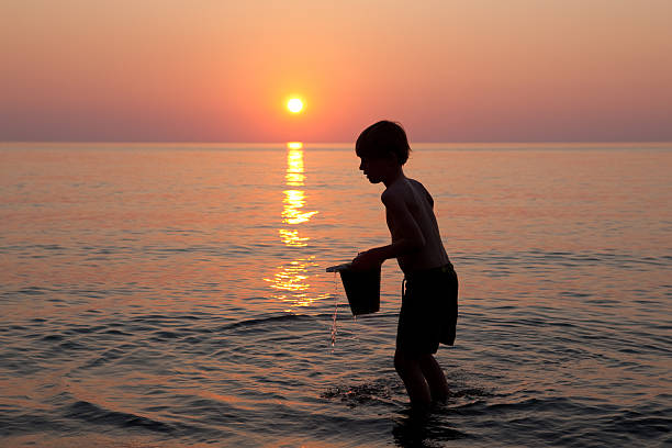 istock Young Boy Playing in Beach at Sunset 171383100