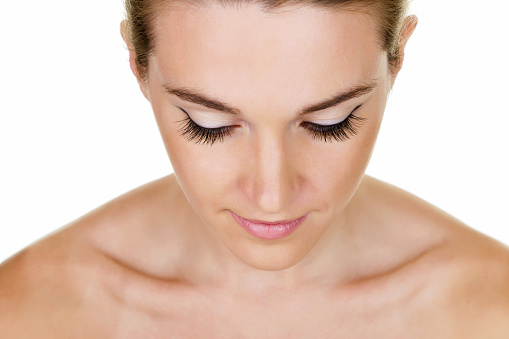 Closeup of a beautiful woman with long eyelashes 