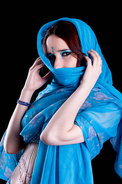 istock Bellydancer in blue with scarf around head. 171383448