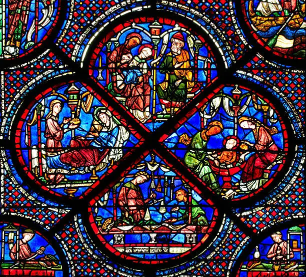 Close up of a part of a stained glass window at the north aisle at the Cathedral Notre Dame, Chartres. The window is called St Nicholas and is made in the 13 th century.