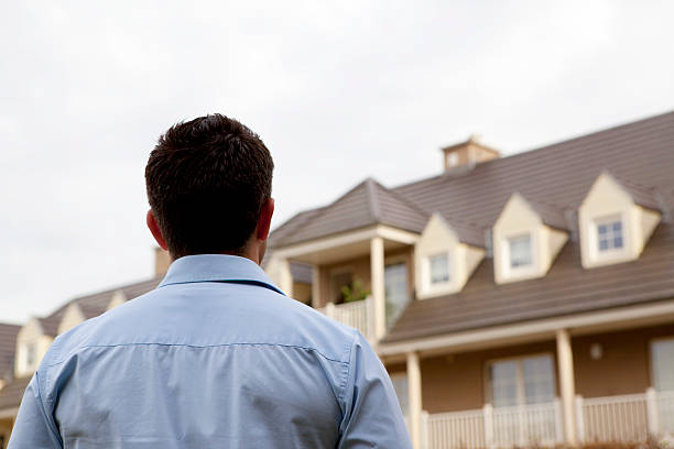 Back view of man shopping for a new home stock photo