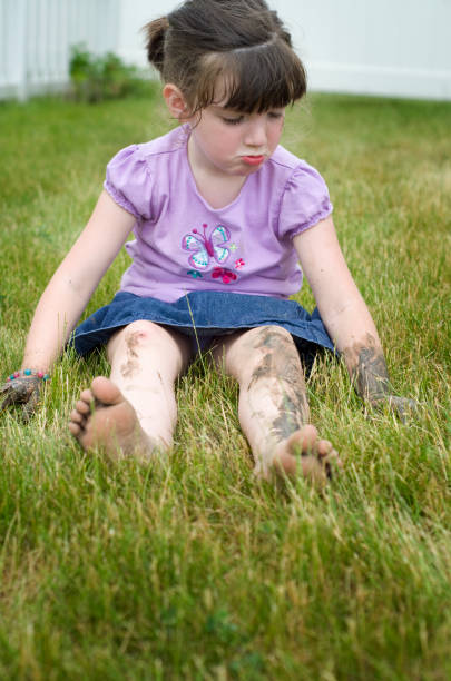istock Muddy girl pouts in the grass 171383678