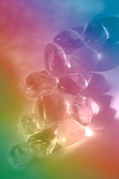 A pile of clear crystals infused with rainbow light and copy space