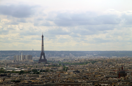 The Eiffel tower against a Paris cityscape.