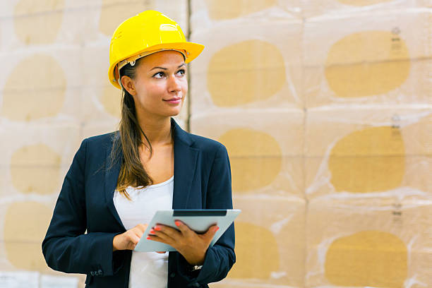istock Smiling businesswoman in distribution warehouse 171384546
