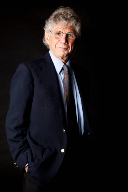 istock senior businessman with hands in pocket 171384803