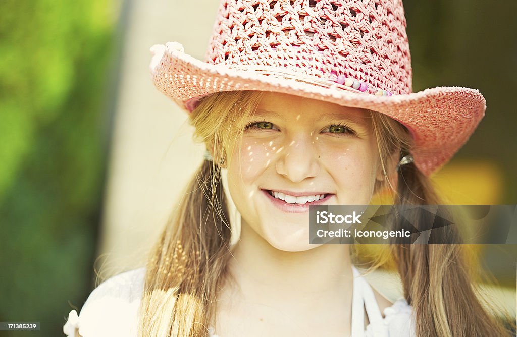 Girl Outdoors Ten year old caucasian girl outdoors wearing summer hat. http://iconogenic.com/STOCK/iconbritt.jpg 10-11 Years Stock Photo