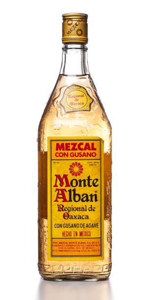 Mount Alban Mezcal with Agave Worm "Miami, USA - July 11, 2012: Monte Alban Mezcal con Gusano de Agave 1000 mL bottle. Monte Alban Mezcal is produced by Mezcal Monte Alban, S.A. de C.V." peyote cactus stock pictures, royalty-free photos & images