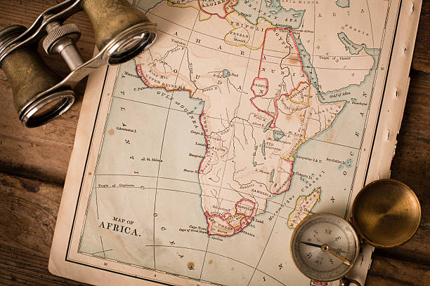 istock Antique 1870 Map of Africa, Binoculars, and Compass on Trunk 171385741