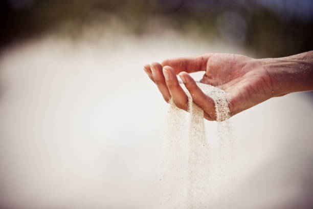 istock Sand slipping through fingers 171385799