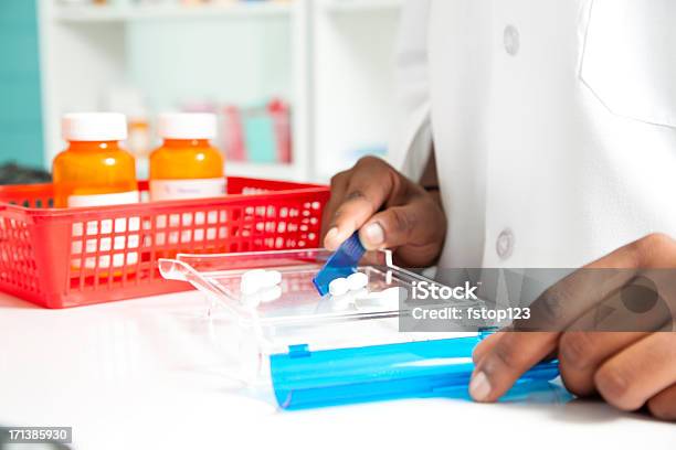 Pharmacist Counting Pills For A Prescription Medicine Pharmacy Stock Photo - Download Image Now