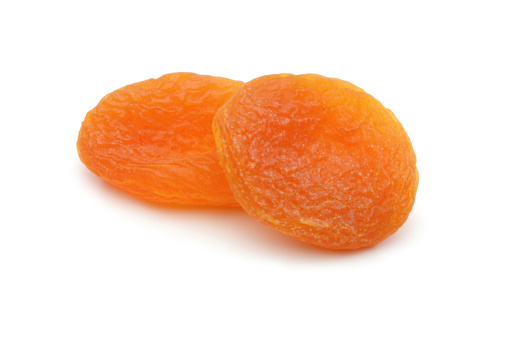 Some dried apricots on a white background