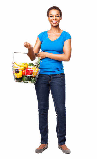 woman carrying a basket of fresh groceries - isolated - kundkorg bildbanksfoton och bilder