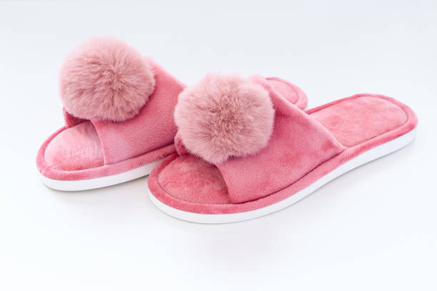 istock Pink home fluffy slippers on white background 1713861587