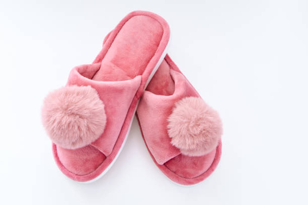 istock Pink home fluffy slippers on white background 1713861789