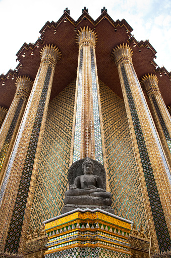 istock Buddha statue outside Phra Mondop (The Library) at Wat Phra Kaew (Temple of the Emerald Buddha), Bangkok Thailand 1713880585