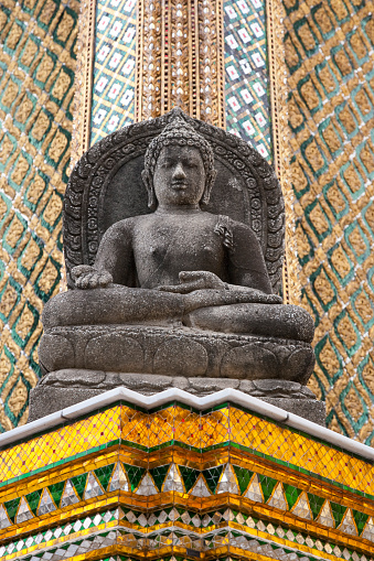 Buddha statue outside Phra Mondop (The Library) at Wat Phra Kaew (Temple of the Emerald Buddha), Bangkok Thailand