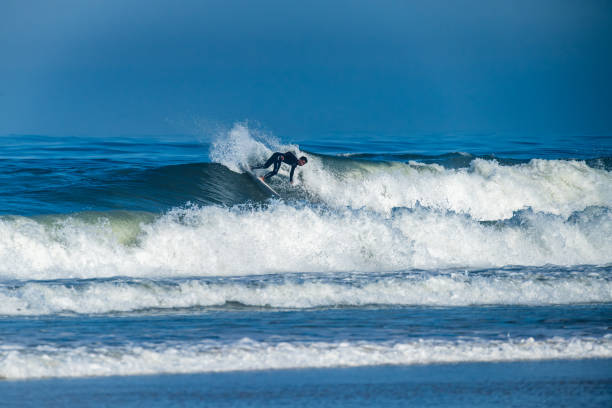 istock Surfer riding waves in Furadouro Beach 1713905119