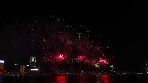 istock Fireworks display at Victoria harbour, Hong Kong 1713906703
