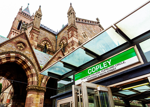 Boston, Massachusetts, USA - September 30, 2023: Copley Square Green Line subway station at the intersection of Dartmouth and Boylston Streets. In the background is the Old South Church (c. 1873) in Boston, also known as New Old South Church or Third Church. It is a historic United Church of Christ congregation first organized in 1669.