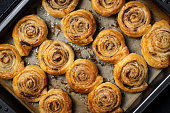 Freshly baked cinnamon buns with spices and cocoa filling