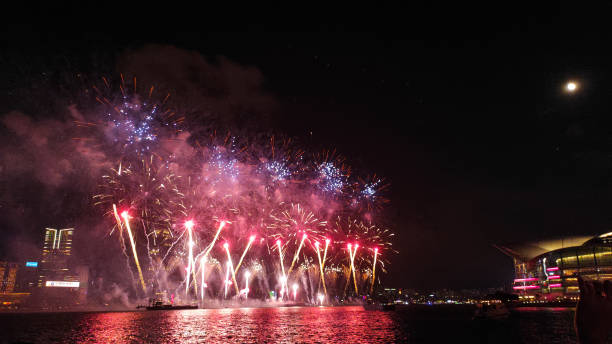 istock Fireworks display at Victoria harbour, Hong Kong 1713942278