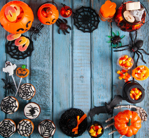 istock Halloween party decorations frame on blue wooden rustic table 1713986506