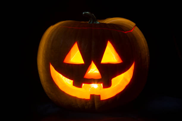 Halloween background. Halloween pumpkin isolated on black.