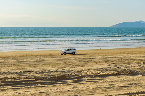 Oceano, California, USA -December 14,  2022.  Cars on the beach. Oceano Dunes, California Central Coast, the only California State Park that allows  vehicles to drive on the beach